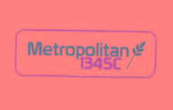 Stylized word Metropolitan 1345C in brown and white with a leaf and golden numbers.